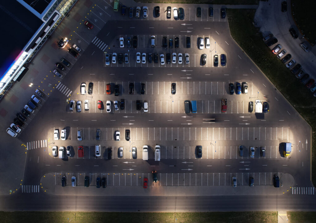 Parking lot at OR Tambo Airport with car at night aerial above top view